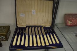 A cased set of fruit knives and forks.