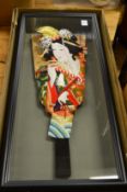 An unusual framed and glazed Japanese fan shaped display of a geisha together with a pair of folding