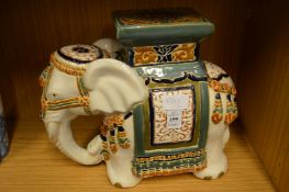 A pottery elephant shaped jardiniere stand.