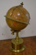 A good small rotating brass globe clock.