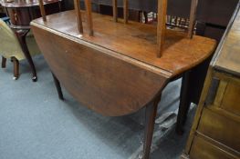 George III mahogany oval drop leaf gateleg dining table on cabriole legs with pad feet.