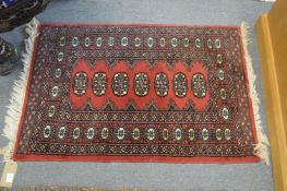 A small Bokara rug 94cm x 64cm.