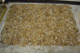 A leather rag rug 190cm x 130cm.