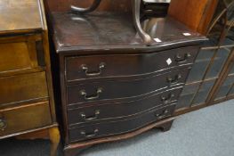 A mahogany serpentine fronted four drawer chest.