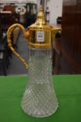A large gilt mounted claret jug.