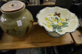 A studio pottery lamp base and a floral decorated pottery pedestal bowl.