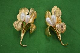 A pair of decorative brooches, signed Uter Que.