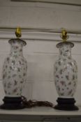 A pair of Chinese style famille rose table lamps.