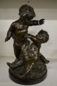 A good bronze group of three playful cherubs, appears unsigned.