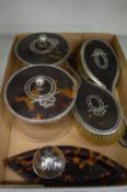 Silver and tortoiseshell mounted dressing table items to include two glass jars with covers and
