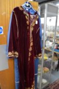 A middle Eastern red velvet housecoat.