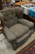 A pair of old Victorian armchairs.