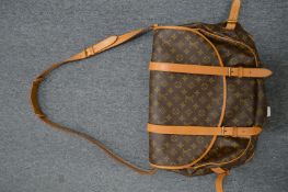 A Louis Vuitton Saumur 43 saddle bag.
