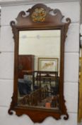 A mahogany fretwork framed mirror.