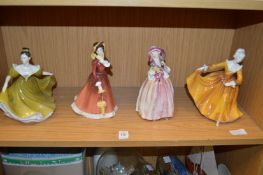Four Doulton figurines.