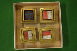 Four brass sets of seals.