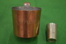 A copper half pint measure and a 1/6 gill.