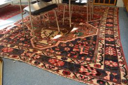A Persian design carpet with stylised decoration 280cm x 206cm.