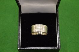 A 1954 one shilling coin ring size L ½.
