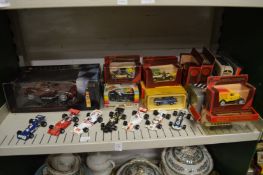 Model formula one cars and other boxed vehicles.