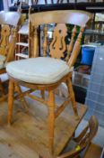 A set of eight beech kitchen chairs.