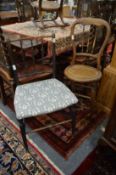 A spindleback occasional chair and a Victorian correction chair.