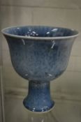 A Chinese blue glazed pedestal bowl.