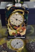 A Moorcroft mantle clock and a spare movement.