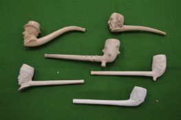 Six Meerschaum pipes.