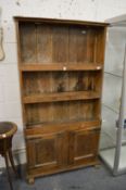 A 19th century rustic hardwood cupboard bookcase.