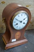 An Edwardian inlaid mahogany balloon shaped mantle clock (faults).