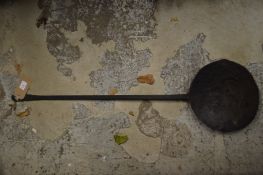 An old wrought iron ladle.