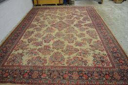 A large Persian style carpet 420cm x 295cm