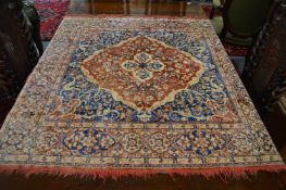 A modern machine made rug 120cm x 120cm.