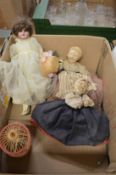 A good small porcelain headed doll and two Nora Welling style tea cosies.