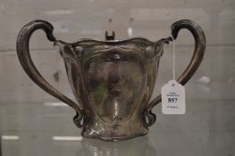 A good large Art Nouveau silver tyg or loving cup engraved with a crest.