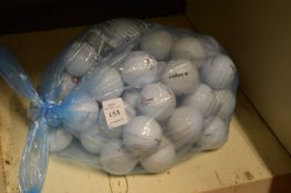 A bag of fifty Pinnacle golf balls.