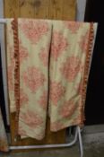 A pair of curtains, cream ground with stylised flower and vase decoration, each 210cm drop x 135cm