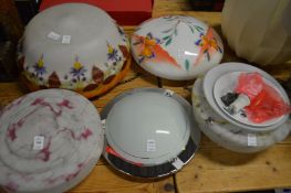 Opaque glass ceiling shades and other lighting.