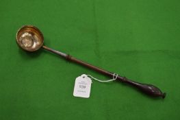 A coin inset silver toddy ladle.