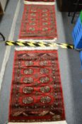 Two small Bokara rugs 100cm x 66cm and 105cm x 65cm.