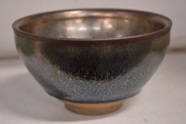 A Chinese hares fur glazed circular pottery bowl.