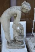 A composite garden water feature modelled as a classical standing female nude by a well.