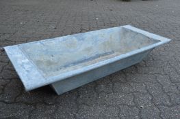 A galvanised rectangular planter/trough.