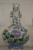 A Chinese peach decorated bottle vase (rim damaged).