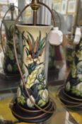 A large Moorcroft table lamp base with shade.