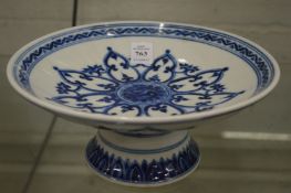 A Chinese blue and white pedestal dish.