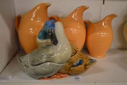 A duck and drake pottery tureen and cover and three jugs.