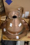 A copper half gallon jug and a copper tray.