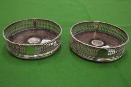 A good pair of silver bottle coasters.